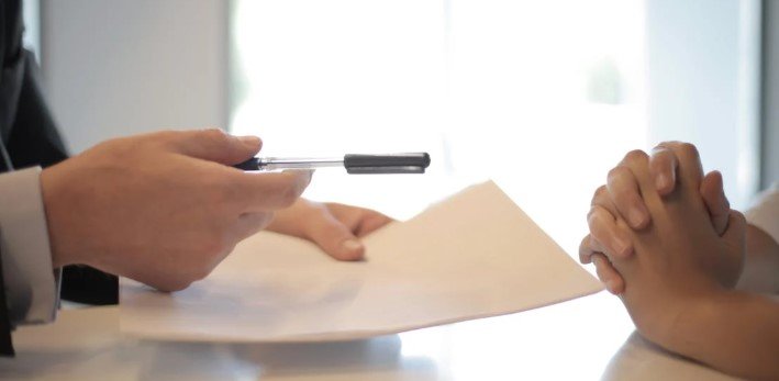 two mens sign contract